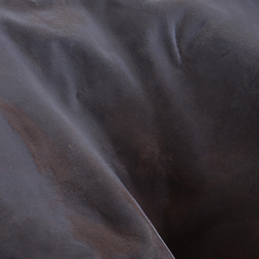 A close-up of a stained couch fabric, highlighting the importance of identifying the type of stain.